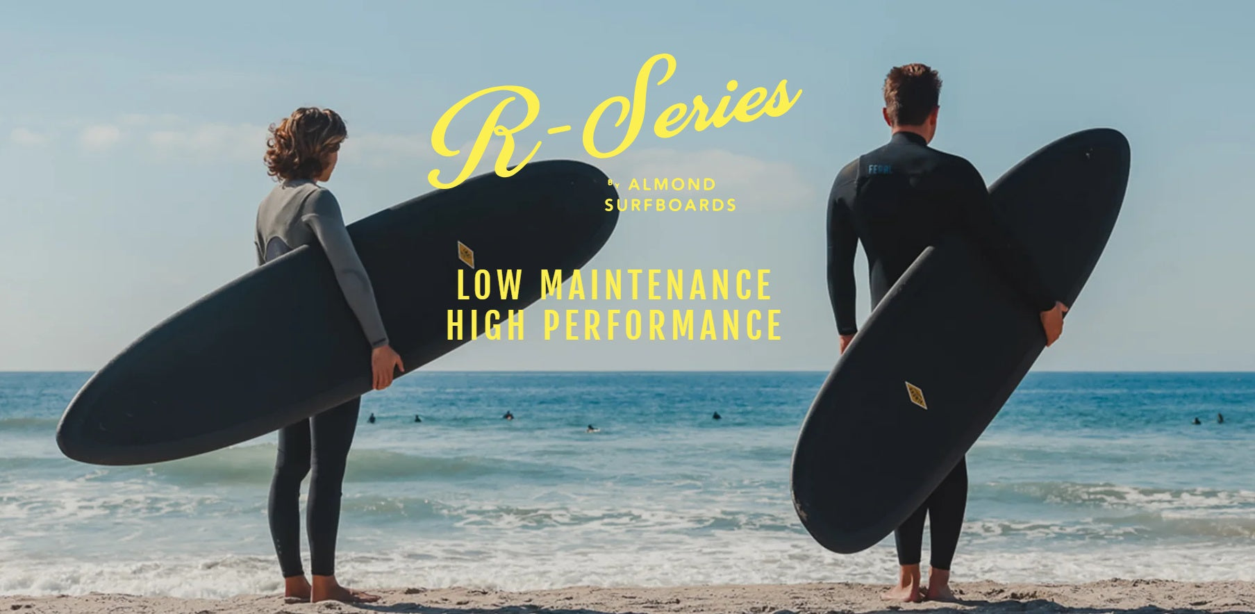 Almond Surfboards R-Series Recyclable Closed-Cell Foam Affordable and Durable Surfboards. Two adults are standing on the beach with their Almond R-Series Surfboards.